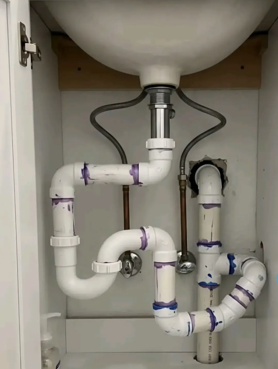 Clean under-sink plumbing pipes and P-trap installation